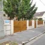 Portails et clôture assortis, motorisation électrique